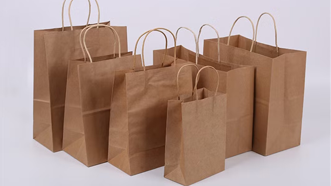 What Are the Key Components and Their Functions in a Handle Paper Bag Making Machine?